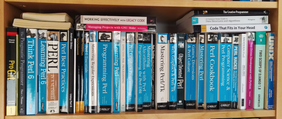 Photo of my bookshelf containing Perl books